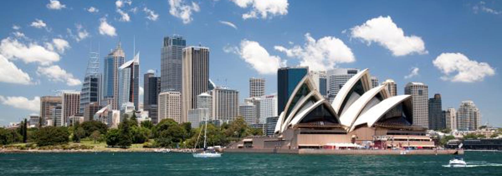 a city skyline with a boat in the water