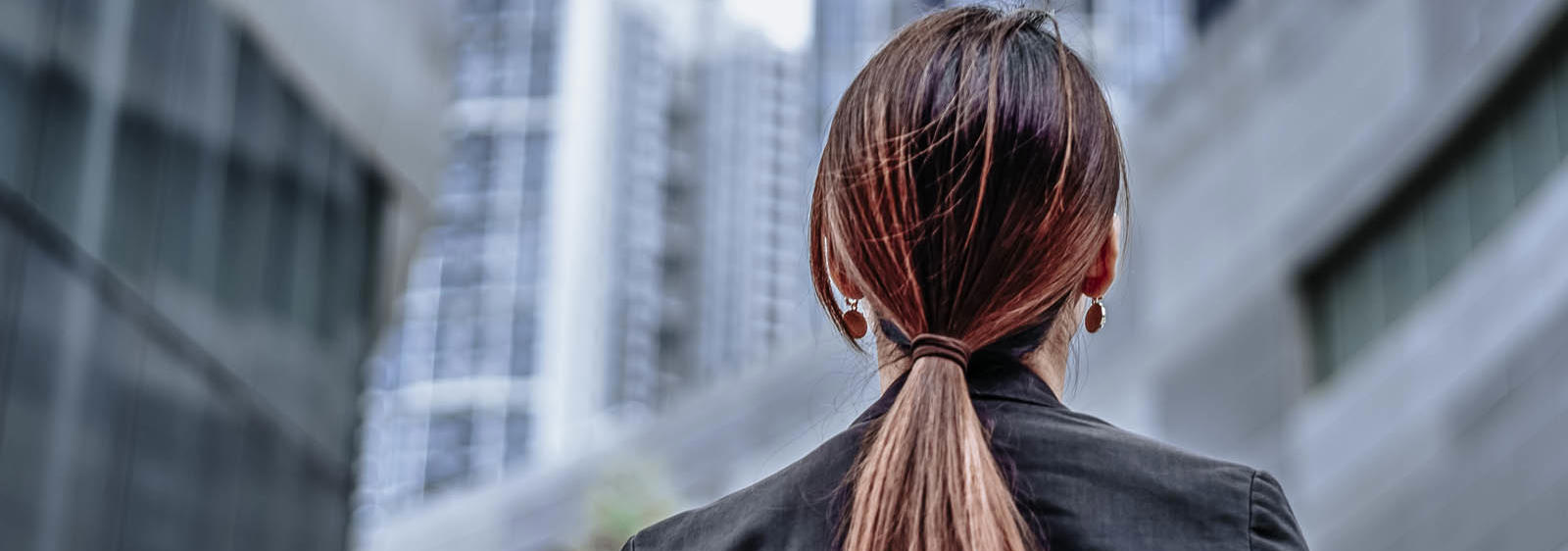 a woman with long hair in a ponytail