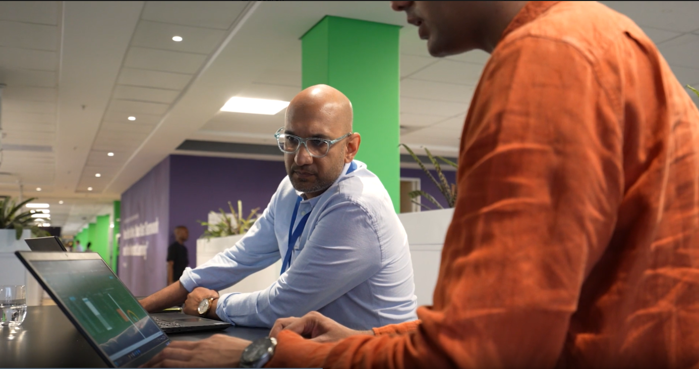 a man looking at a laptop