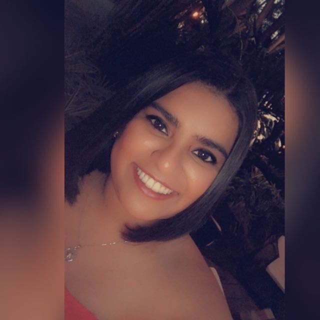 a woman smiling for a selfie