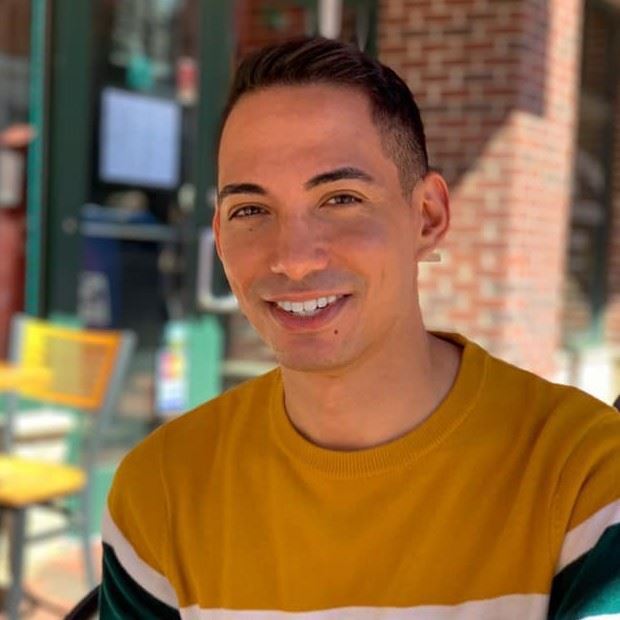 a man smiling at camera