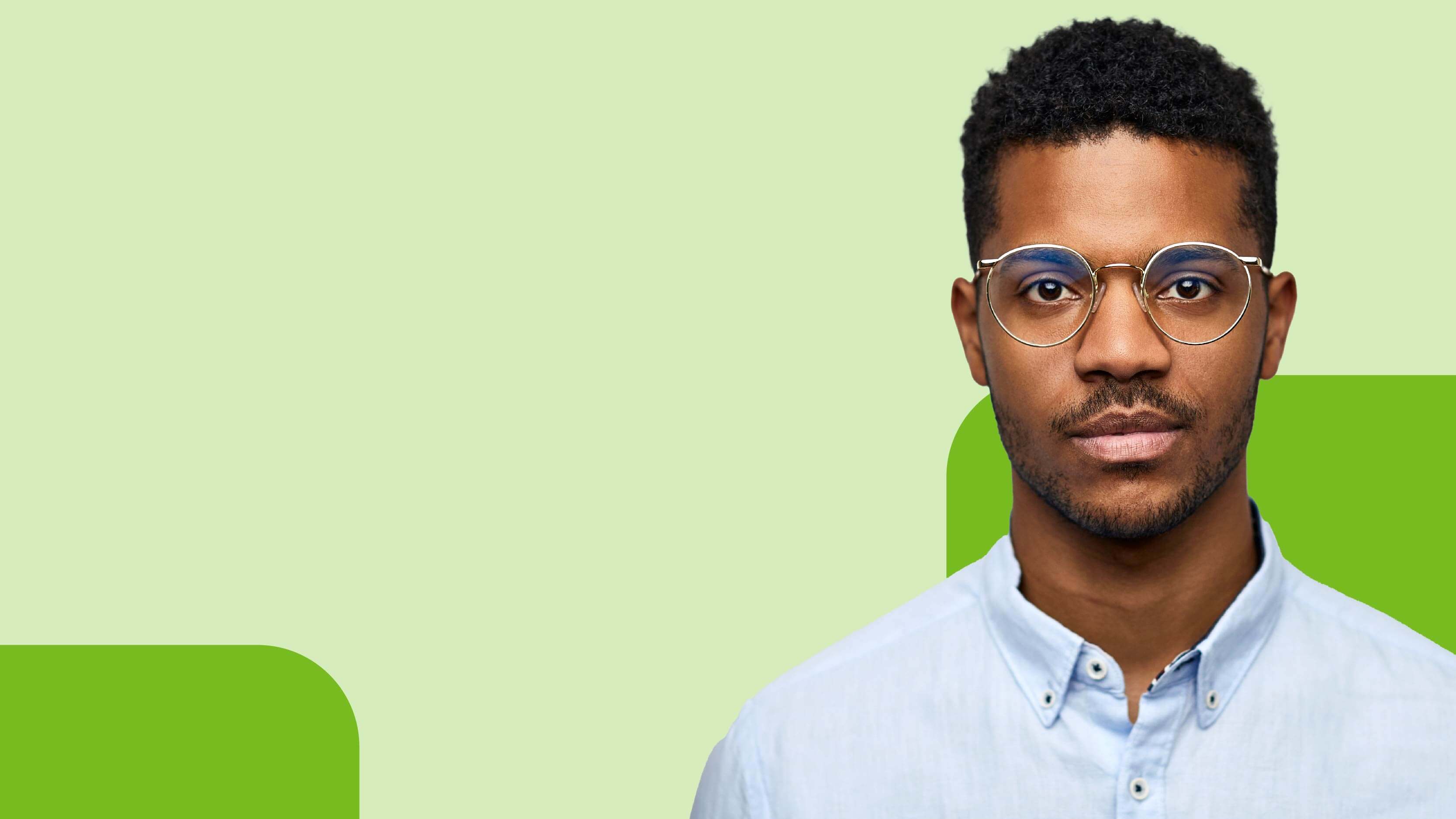 a man wearing glasses and a blue shirt