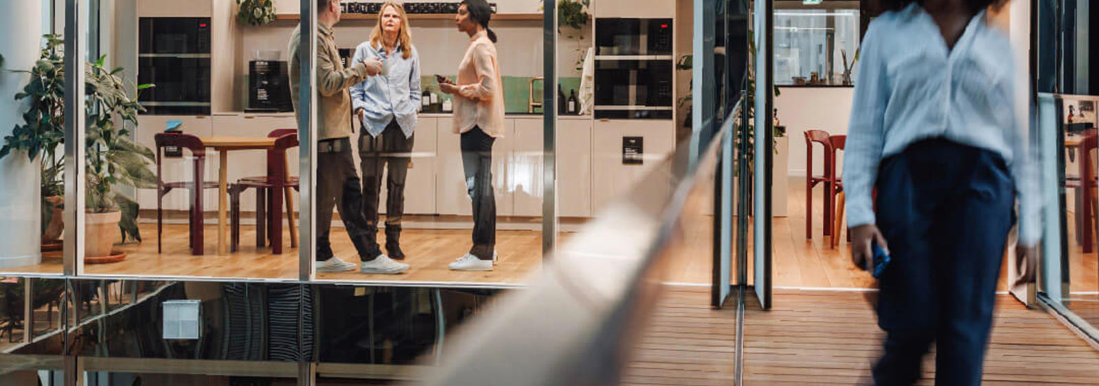 a group of people walking in a room